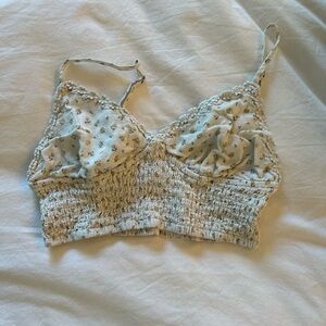 yellow floral crop top with adjustable straps and elasticized back